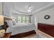 Spacious main bedroom features tray ceilings, windows, and a view to the primary bath at 2740 Laurelcherry St, Raleigh, NC 27612