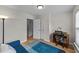 Cozy office space with hardwood floors, a modern desk, and a comfortable blue sofa at 2740 Laurelcherry St, Raleigh, NC 27612
