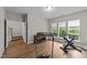 Versatile workout room with a treadmill, stationary bike, and wood-look flooring at 2740 Laurelcherry St, Raleigh, NC 27612