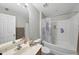 Bathroom with tub and shower combo and a vanity with sink and a large mirror at 2910 Barrymore St # 100, Raleigh, NC 27603