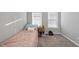 Small bedroom with a twin bed, a nightstand, and natural light from the windows at 2910 Barrymore St # 100, Raleigh, NC 27603