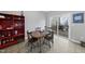 A dining table with chairs sits near a sliding glass door leading to the deck at 2910 Barrymore St # 100, Raleigh, NC 27603