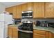 A close-up of the kitchen appliances and cabinets shows off the features of the home at 2910 Barrymore St # 100, Raleigh, NC 27603