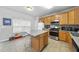 The kitchen features an island, stainless steel appliances, and plenty of counter space at 2910 Barrymore St # 100, Raleigh, NC 27603