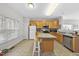 This kitchen features an island, ample counter space, and lots of natural light at 2910 Barrymore St # 100, Raleigh, NC 27603