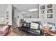 This living room features comfortable seating, decor, and a view to the second story at 2910 Barrymore St # 100, Raleigh, NC 27603