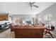 Bright living room with leather furniture, a large window, and a ceiling fan at 2910 Barrymore St # 100, Raleigh, NC 27603