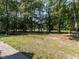 Expansive backyard with mature trees, offering privacy and ample space at 301 Monterey Ct, Benson, NC 27504