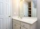 Bathroom featuring white vanity, sink, mirror, and medicine cabinet at 301 Monterey Ct, Benson, NC 27504