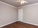 Neutral bedroom featuring wood-look flooring and a ceiling fan at 301 Monterey Ct, Benson, NC 27504