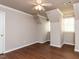 Upstairs bedroom features wood-look flooring and two windows at 301 Monterey Ct, Benson, NC 27504