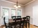 Dining room features a traditional table, chairs, and a view to the backyard at 301 Monterey Ct, Benson, NC 27504