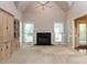 Spacious living room with a fireplace, built-in cabinets, and vaulted ceilings at 301 Monterey Ct, Benson, NC 27504