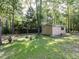 Exterior view of the storage shed in a wooded backyard at 301 Monterey Ct, Benson, NC 27504