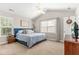 Bedroom with vaulted ceilings, ceiling fan, and natural light from the windows at 303 Sylvias Ct, Durham, NC 27703