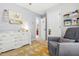 Calming Bedroom showcases a white dresser and grey chair, and has an ensuite bathroom and closet access at 303 Sylvias Ct, Durham, NC 27703