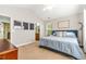 Bright bedroom with neutral walls, carpet flooring, and a comfortable blue bed and motivational wall decor at 303 Sylvias Ct, Durham, NC 27703