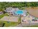 An aerial view showcasing the pool, playground, and sand volleyball area that are part of the community's amenities at 303 Sylvias Ct, Durham, NC 27703