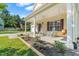 Inviting front porch featuring classic rocking chairs, a wooden swing and attractive landscaping at 303 Sylvias Ct, Durham, NC 27703