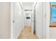 Upstairs hallway features multiple linen closets and carpet floors at 303 Sylvias Ct, Durham, NC 27703