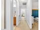 Hallway features neutral carpet, fresh paint, and access to the bathroom and bedroom at 303 Sylvias Ct, Durham, NC 27703