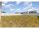 Spacious, grassy backyard enclosed by a white fence, perfect for outdoor activities at 311 Horseshoe Pl, Angier, NC 27501