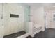 Modern bathroom with glass shower, soaking tub, and designer tile finishes at 311 Horseshoe Pl, Angier, NC 27501