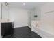 Bright bathroom featuring a glass shower, separate tub, and a double sink vanity at 311 Horseshoe Pl, Angier, NC 27501