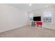Bedroom featuring carpet floors and natural light from two large windows at 311 Horseshoe Pl, Angier, NC 27501