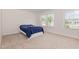 Neutral bedroom with carpet floors and natural light from two large windows at 311 Horseshoe Pl, Angier, NC 27501