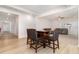 A wooden table with seating for four, with an open concept view into the living room at 311 Horseshoe Pl, Angier, NC 27501