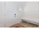 Inviting foyer with a coat rack, bench, and decorative rug, offering a warm welcome at 311 Horseshoe Pl, Angier, NC 27501