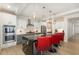 Bright kitchen featuring a marble-look island, stainless appliances and white and gray cabinetry at 311 Horseshoe Pl, Angier, NC 27501