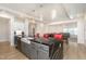Spacious kitchen featuring a central island with seating, flowing into the dining and living spaces at 311 Horseshoe Pl, Angier, NC 27501