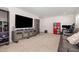 Spacious living room with entertainment center, comfortable seating, and neutral carpet at 311 Horseshoe Pl, Angier, NC 27501