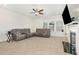 Spacious living room with a comfortable sectional sofa, fireplace, and lots of natural light at 311 Horseshoe Pl, Angier, NC 27501