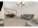 Open-concept living space with dining area, kitchen, and living room featuring modern finishes and ample space at 311 Horseshoe Pl, Angier, NC 27501