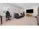 Inviting living room with ample natural light, comfortable seating, and entertainment setup at 311 Horseshoe Pl, Angier, NC 27501