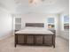 Spacious main bedroom with tray ceiling, carpet floors, and natural light from multiple windows at 311 Horseshoe Pl, Angier, NC 27501