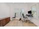 Bright office space with natural light, exercise equipment, and a wooden cabinet for storage at 311 Horseshoe Pl, Angier, NC 27501