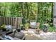 Relaxing backyard with comfortable seating, a lush garden, and a cozy fire pit at 318 Silverberry Ct, Cary, NC 27513