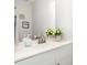 Bathroom featuring dual sinks with a large mirror and neutral decor at 318 Silverberry Ct, Cary, NC 27513