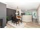 Dining room with an open layout, modern light fixture, and views to the kitchen at 318 Silverberry Ct, Cary, NC 27513