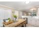 The kitchen area features an island, stainless steel appliances, and white countertops at 318 Silverberry Ct, Cary, NC 27513
