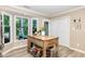 A bright kitchen offers an island with an abundance of storage and natural light from large windows at 318 Silverberry Ct, Cary, NC 27513