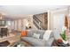 Inviting living room featuring neutral color scheme, staircase, and hardwood floors at 318 Silverberry Ct, Cary, NC 27513