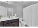 Modern bathroom featuring a sleek vanity with ample countertop space and a stylish shower curtain at 325 Buckhorn Branch Park, Clayton, NC 27520