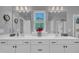 Bathroom featuring double vanity with undermount sinks and a view from the window at 325 Buckhorn Branch Park, Clayton, NC 27520
