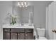 Clean, bright bathroom with a vanity, stylish mirror, and essential fixtures at 325 Buckhorn Branch Park, Clayton, NC 27520