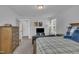 Cozy bedroom with a comfortable bed, couch and media center, providing a relaxing and entertaining space at 325 Buckhorn Branch Park, Clayton, NC 27520
